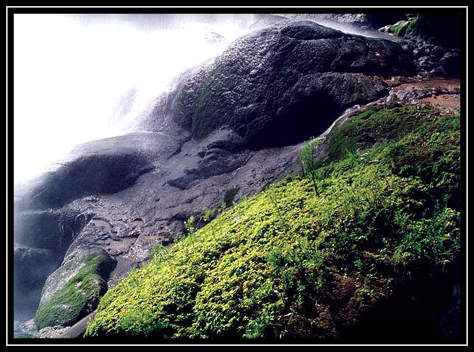 Under the Mizol-Ha waterfalls