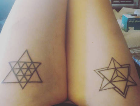 Freehand geometric poke and stick thigh tattoos 