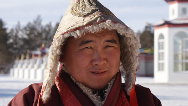 a portrait of a buddist monk