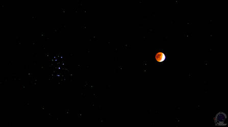 Partial Lunar Eclipse and the Pleiades cluster..