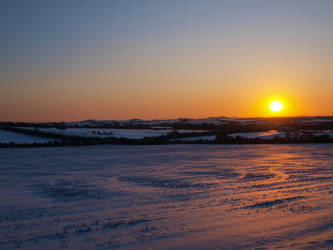 sun set over the snow