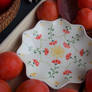 Persimmon fruits around a plate