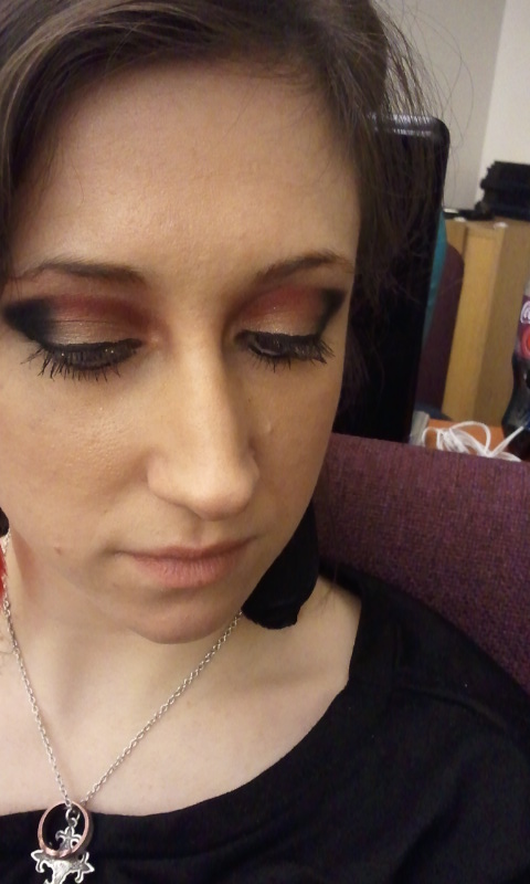 gold, black, and red eyeshadow
