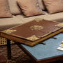 Huge old leather book on table