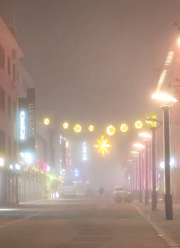 The city in the fog of Christmas time