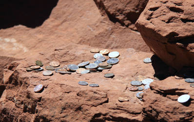 Coins on rock stock