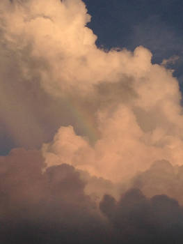 Rainbow surrounded by clouds