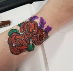 Dark roses on skin