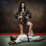 He is erect under her silky foot..
