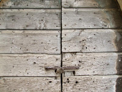 Wood door with rusty handle