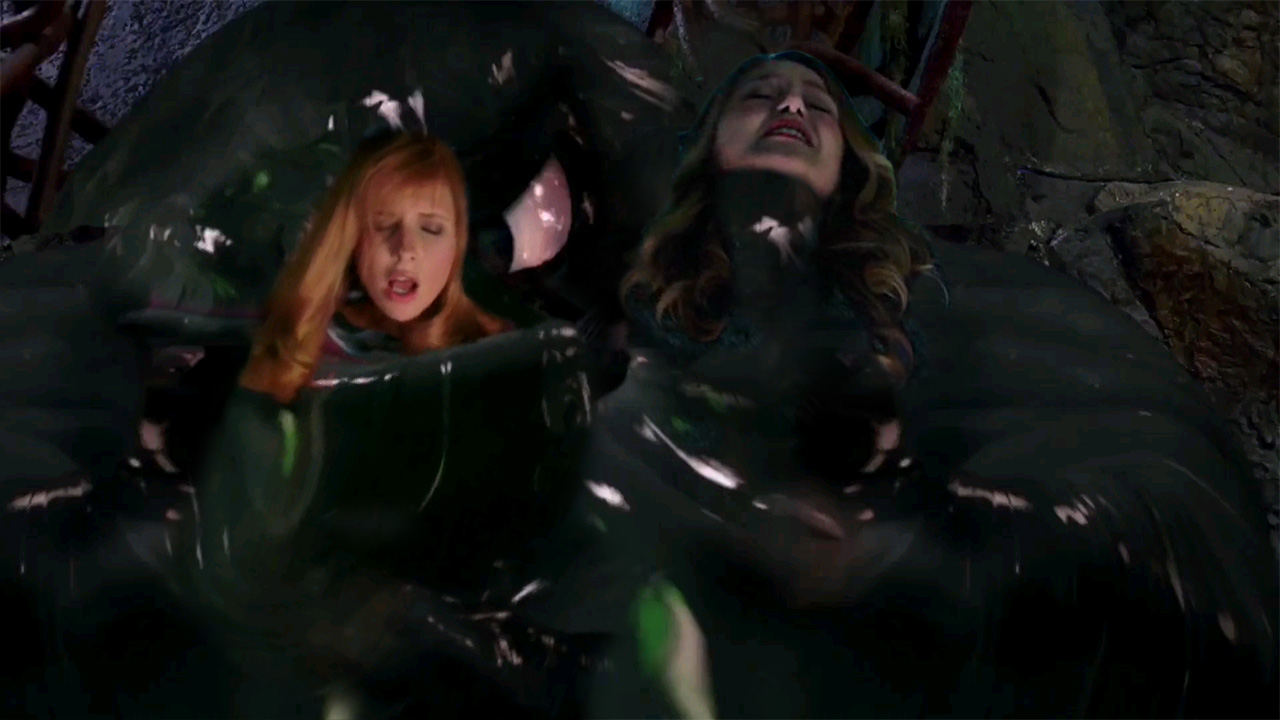 Supergirl and Daphne caught by Tar Monster