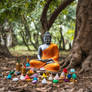 Buddha and ccolorsful things under a tree.