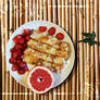 Russian pancakes with grapefruit and strawberry