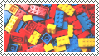 A stamp depicting a pile of multicolored lego blocks.