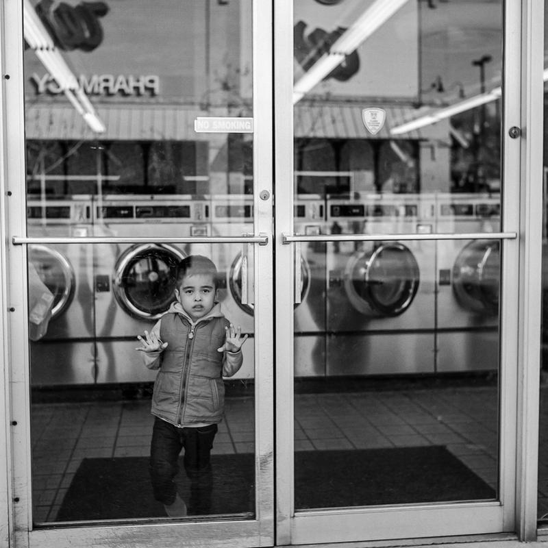 Boy at the Laundromat by jonniedee Boy at the Laundromat by jonniedee