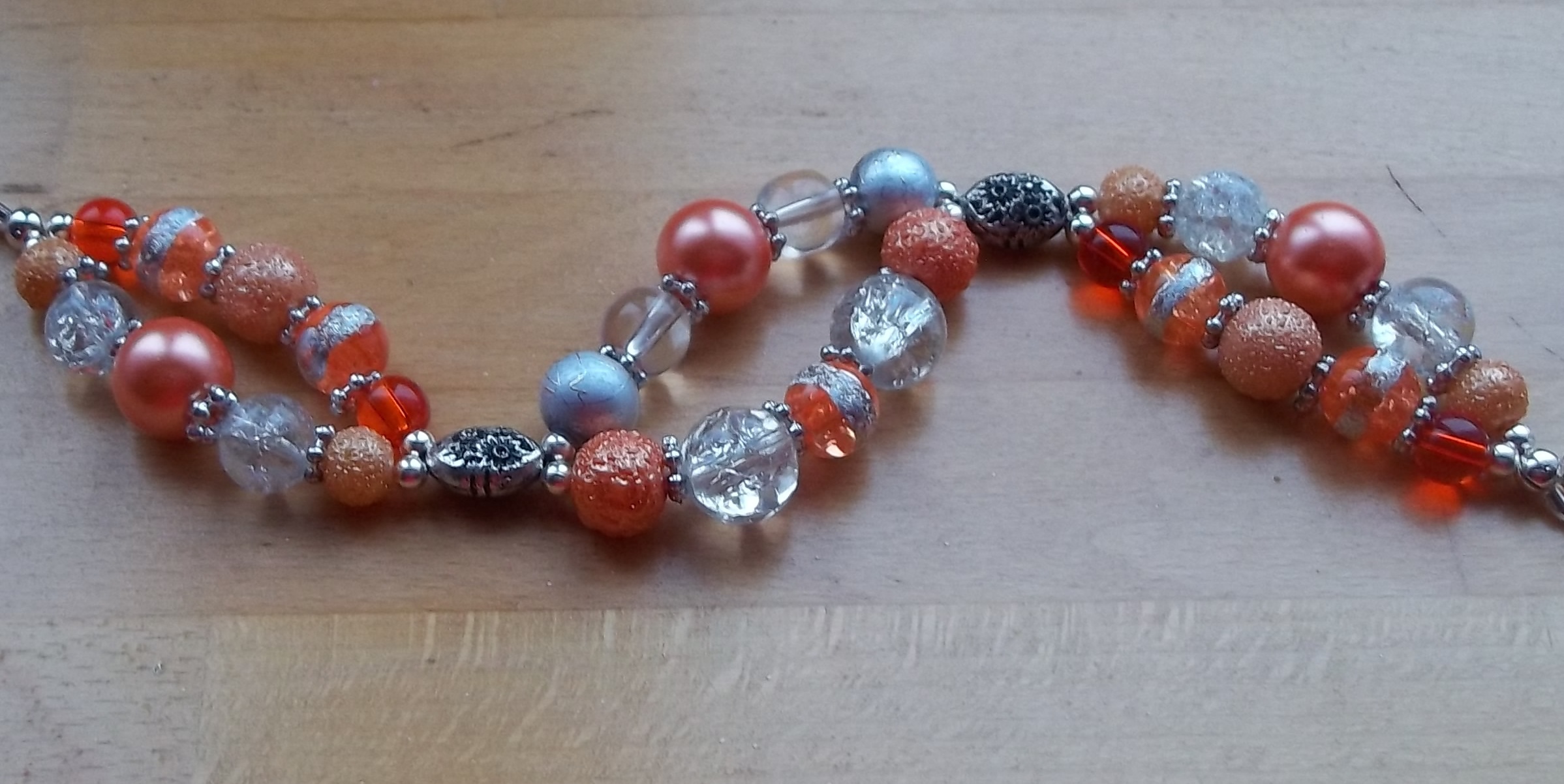 Orange and silver two strand bracelet