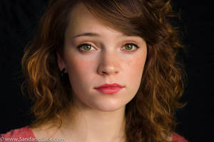 Beautiful teen model with red hair and green eyes