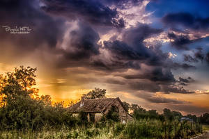 -Old house and  stormy sky-