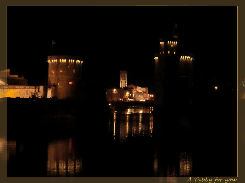 a small port town at night