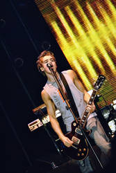 McFly on stage perform