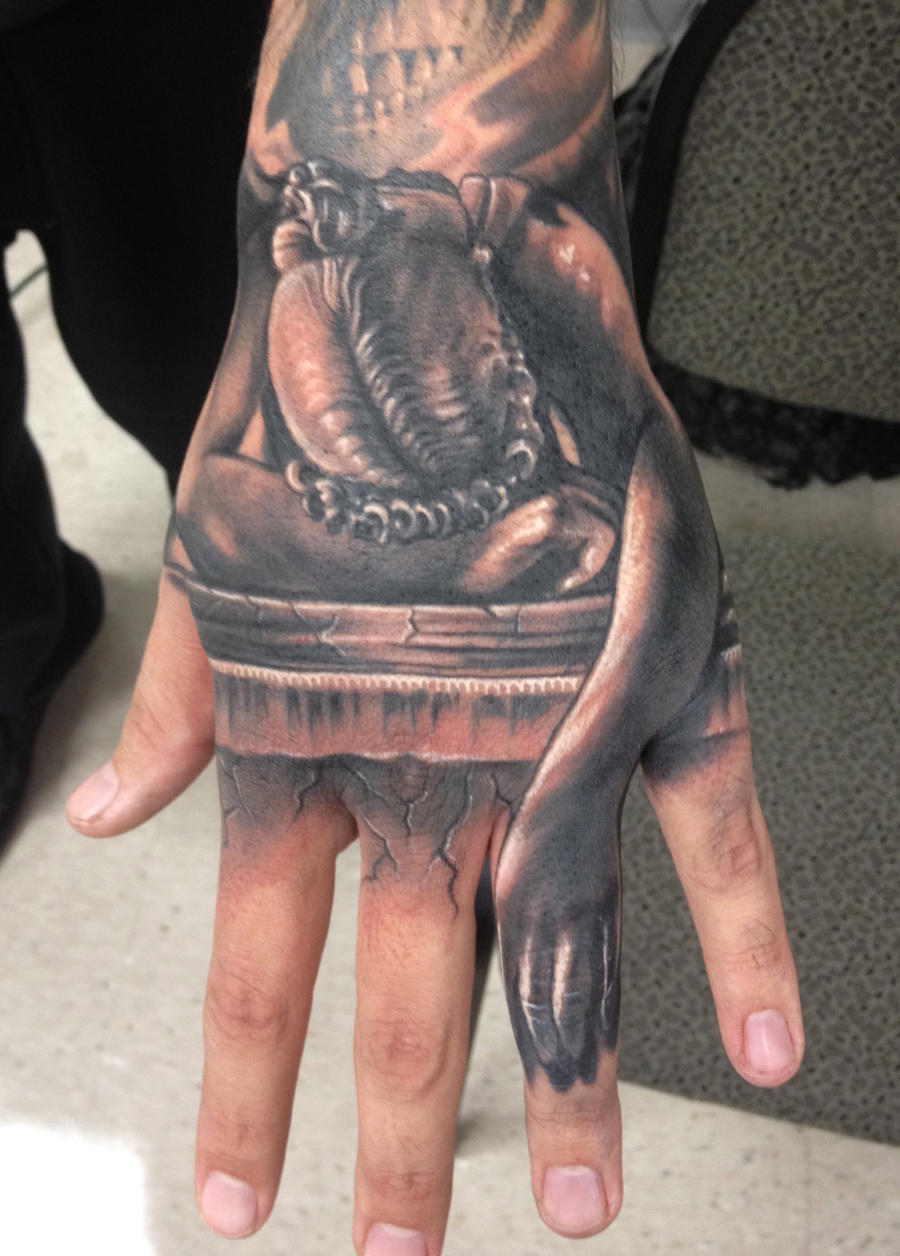 statue hand tattoo