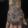demon hand tattoo