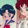 Amy (Ami) blushing and smiling with Lita (Makoto)