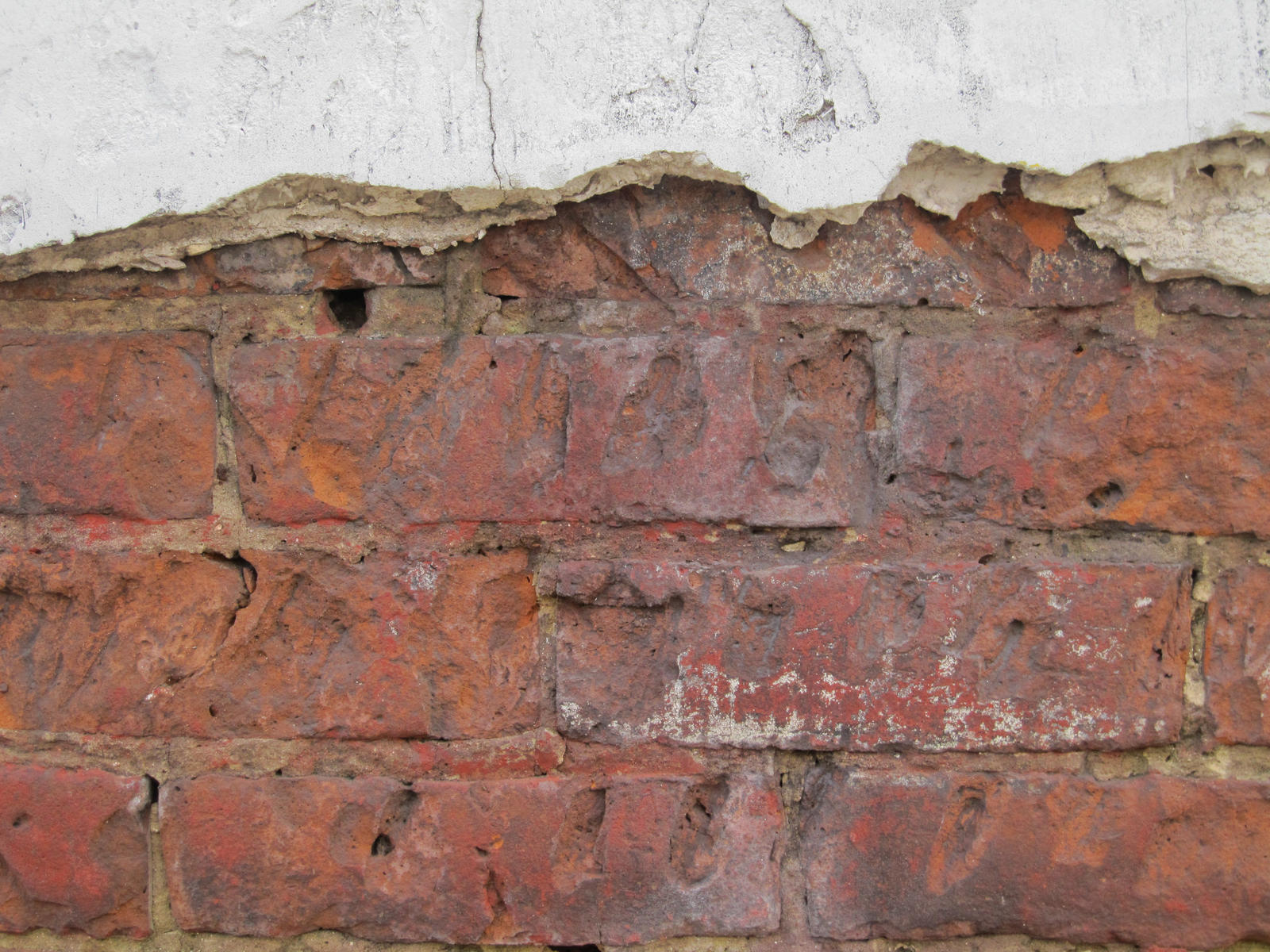 Cracked Plastered Brick Wall by element321
