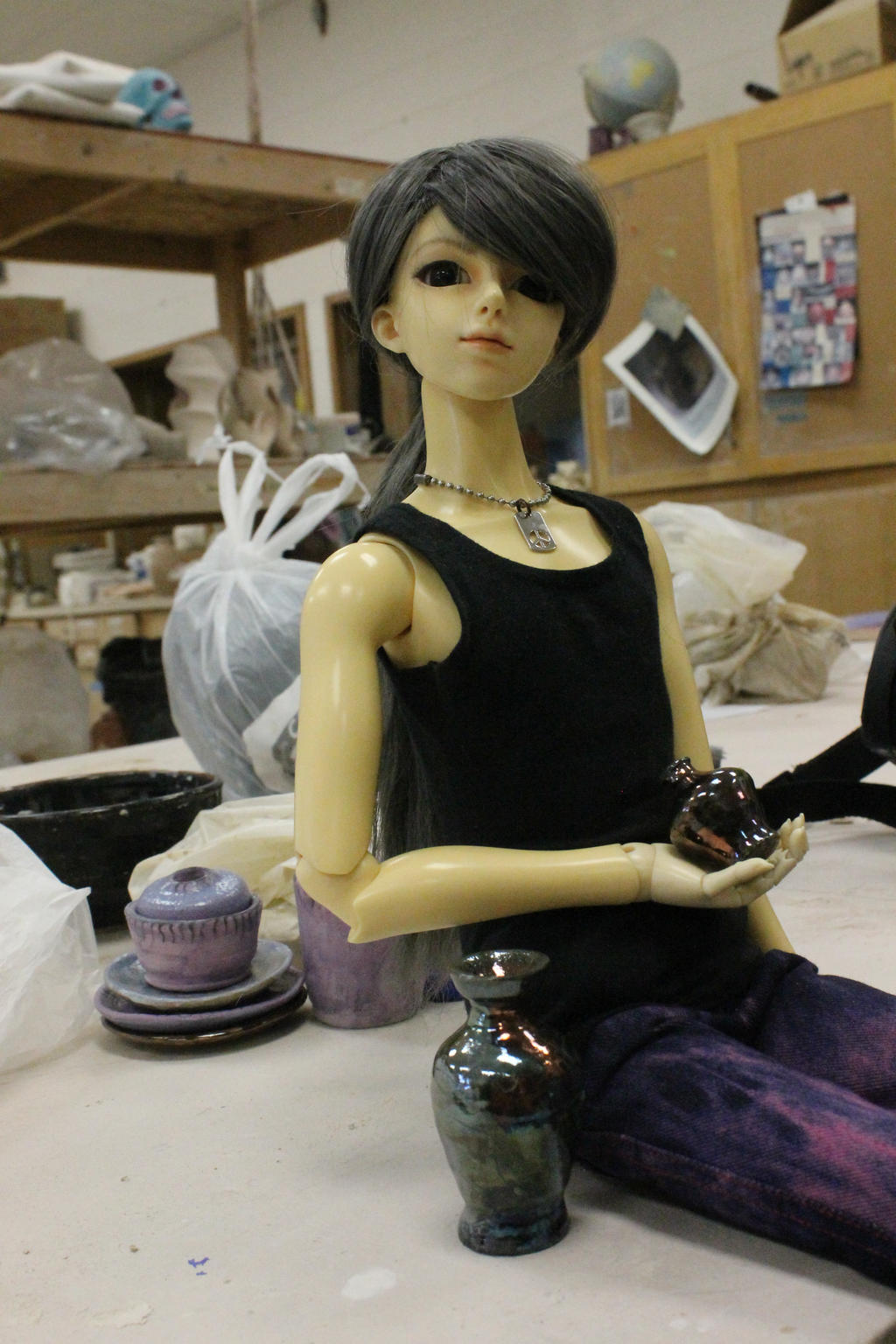 Azrael show the hand thrown pots I made him