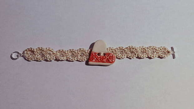 Crochet bracelet with ceramic heart