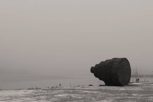 Rock art statue alone in the mist