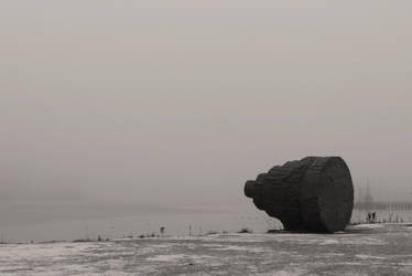 Rock art statue alone in the mist