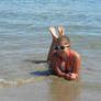 Girl feet on beach