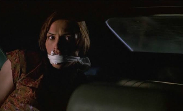 Famke Janssen gagged