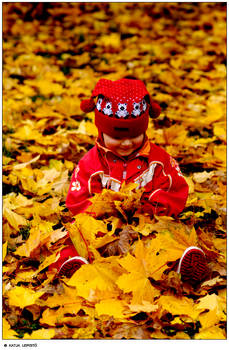 Sitting and playing with leafs