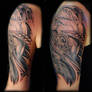 Biomechanical black and gray tattoo