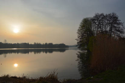 Foggy and cold Sunset over lake