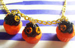 Jack O' Lantern Cupcake Neckla by tyney123