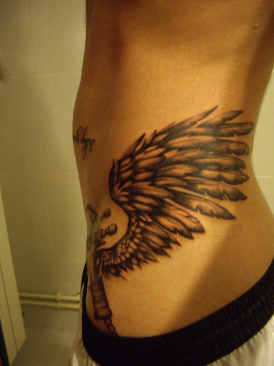 winged paint gun spray tattoo