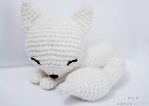 sleepy white fox