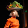 Tray of vegetables on woman's head