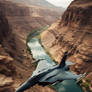Fighter aircraft flying over canyon and river