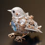 Silver mechanical bird with blue crystals