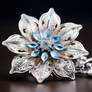 Silver flower with blue crystals