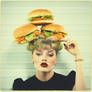 Burgers on woman's head. Portrait photography