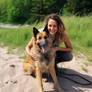 Young woman hugging her shepherd dog