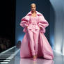 Woman in pink outfit Barbie style. Fashion show