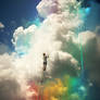 Person painting clouds in rainbow colours