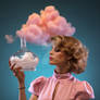 Woman holds glass flask with pink clouds