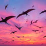 Pterodactyls or frigates birds fly over sea
